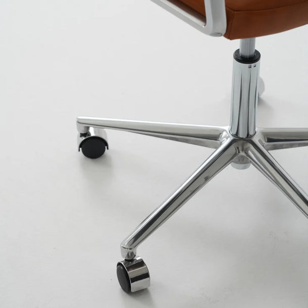 Brown office chair with a metal frame on a white floor