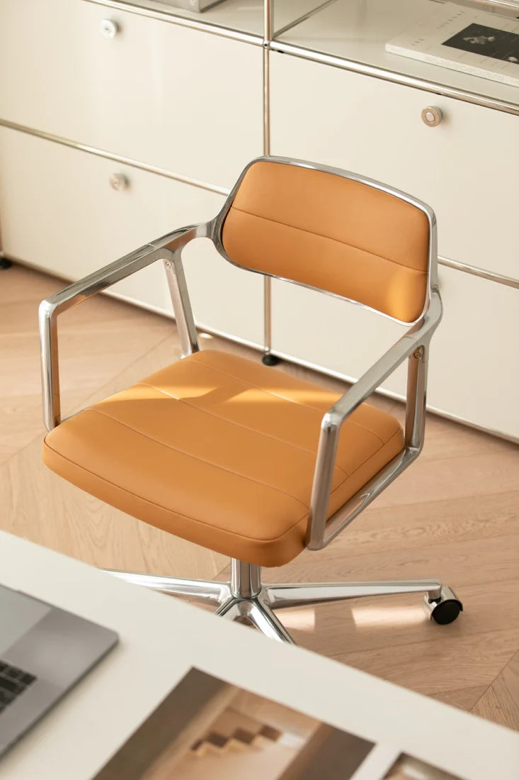 Orange office chair with metal frame on a wooden floor