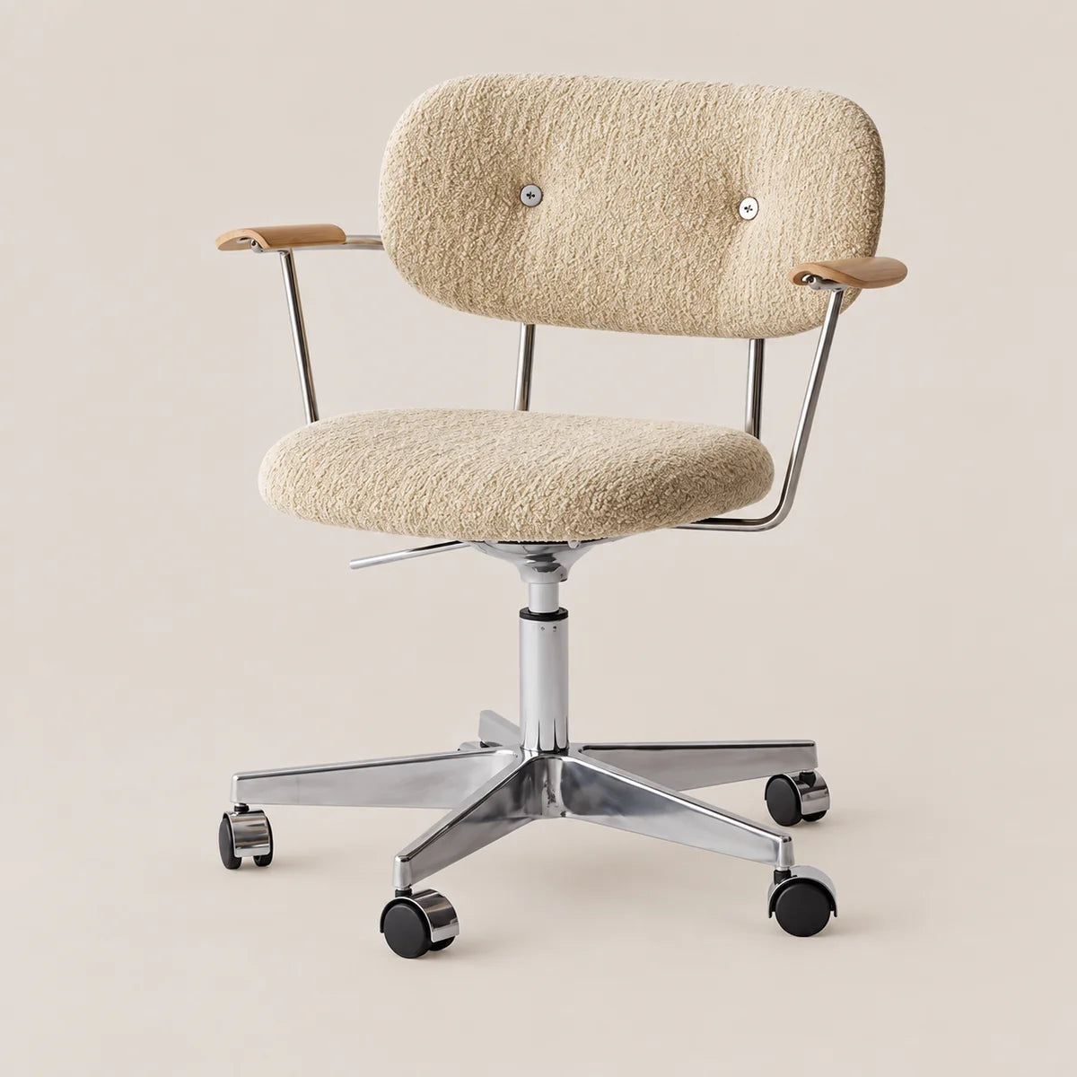 A modern office chair with a textured beige bouclé upholstered seat and backrest, light wood armrests, and a chrome five-star base with black casters, shown against a solid beige background.