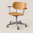 An adjustable office chair with a standard wood upholstered seat and backrest, chrome metal frame and base, and light wood armrest caps, shown on a plain beige background.