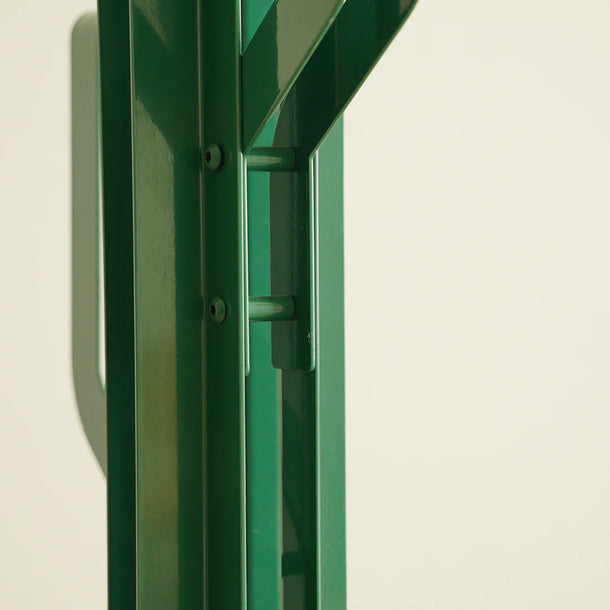 Green metal frame on a beige background
