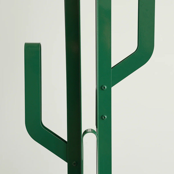 Green metal cactus-shaped object on a white background