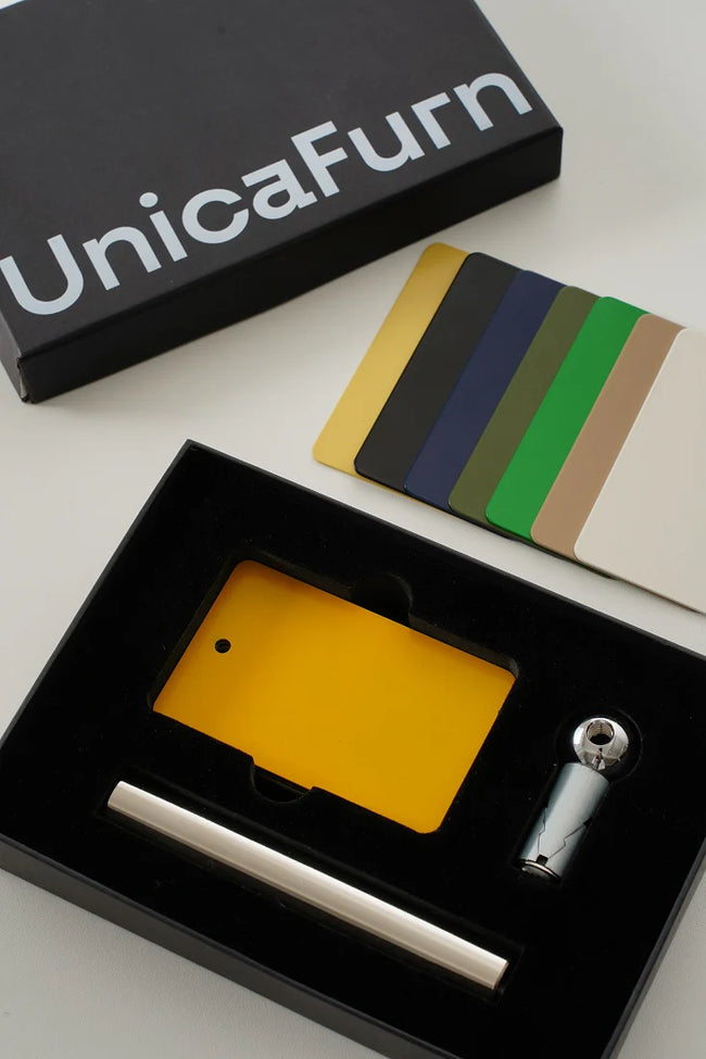 Set of card holders and a pen in a black box with 'UnicaFurn' branding.