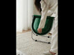 A green folding PC chair with a tubular chrome-plated steel base.
