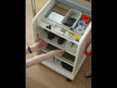 A white mobile utility cart with multiple storage shelves.