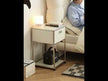 A dynamic showcase of the UF Nexus Bedside Table in a home bedroom setting.