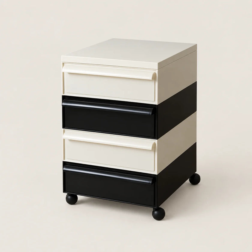 A four-drawer rolling storage cabinet with a modern color-blocked design. The cabinet features alternating cream and black drawer fronts and side panels, with a cream top surface and black caster wheels at the base, photographed against a solid light beige background.