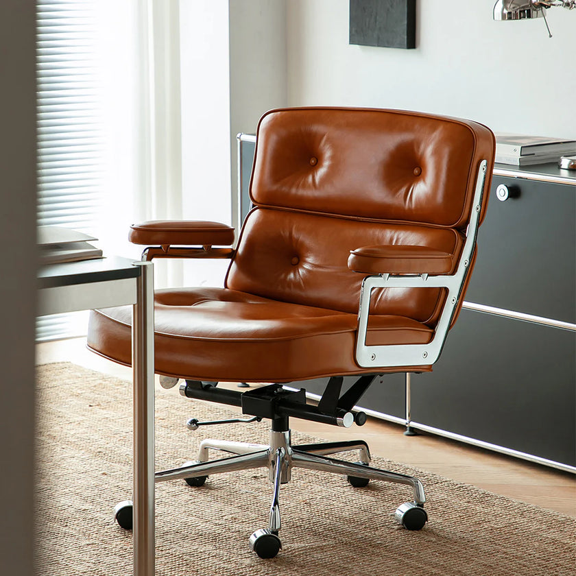 Brown leather office chair in a modern office setting