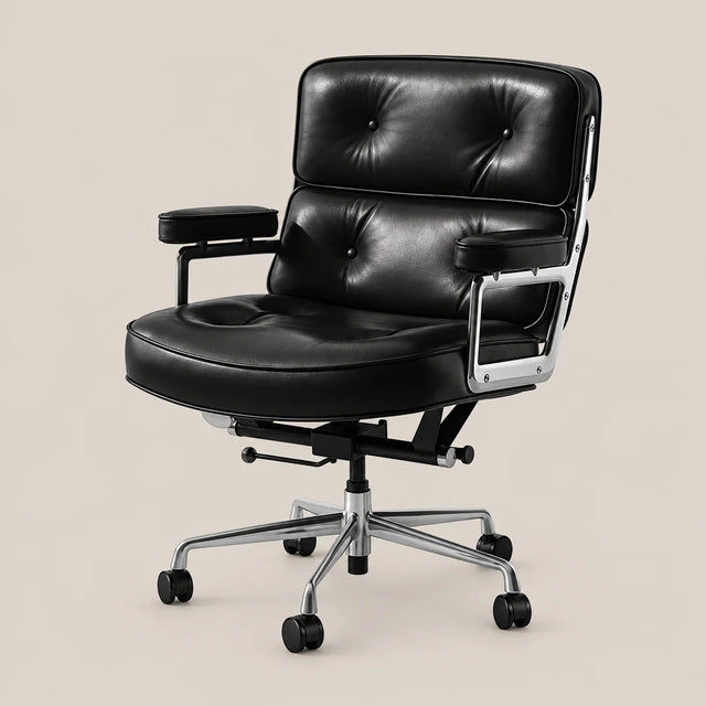 A modern black leather office chair with tufted backrest and seat, chrome arm supports, and a five-wheel swivel base, shown against a solid beige background.