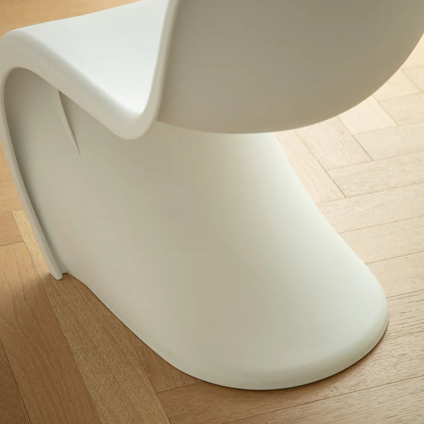 White chair on a wooden floor