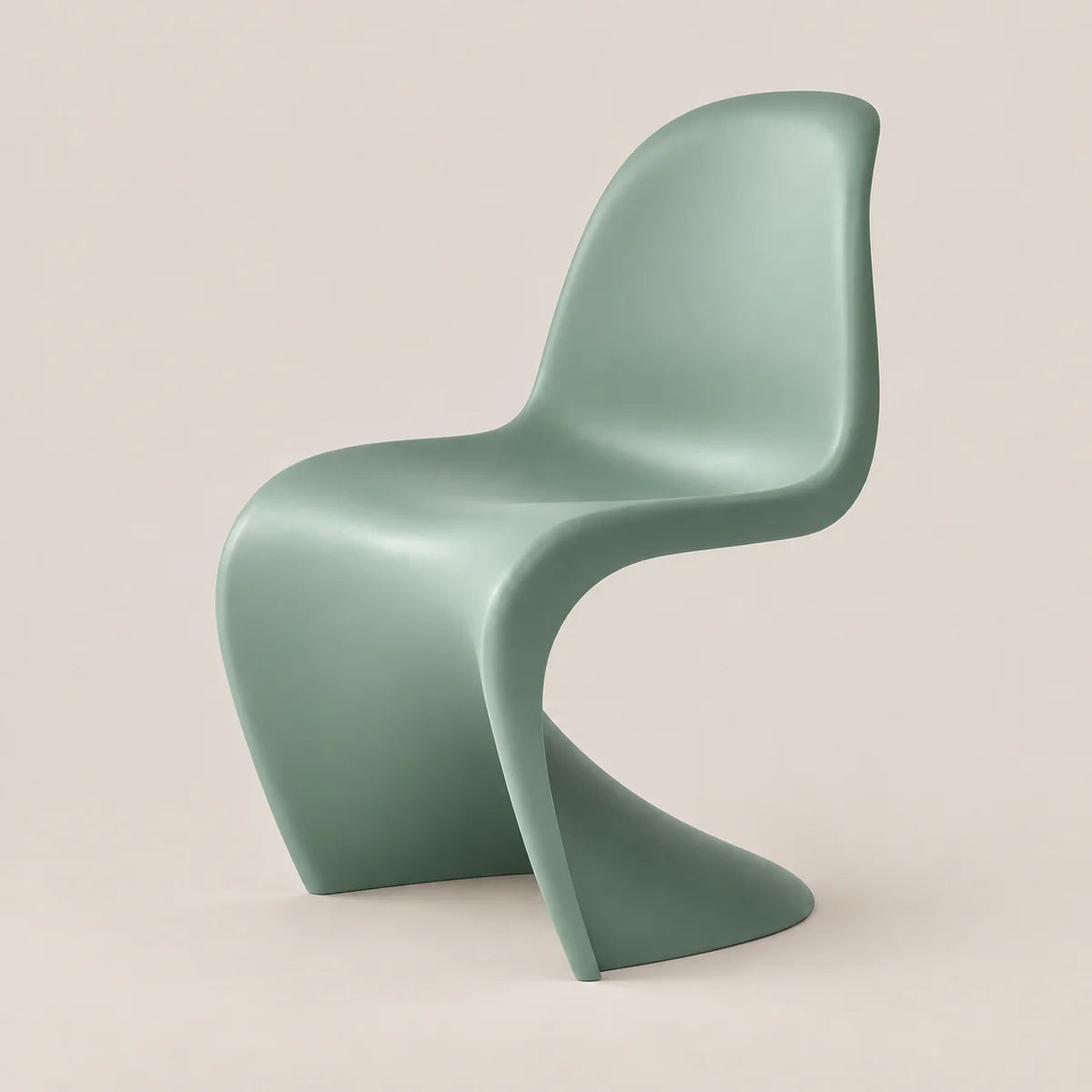 A modern sculptural chair in a muted sage green color, photographed against a solid, warm off-white background.