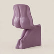 A sculptural modern chair in a matte dusty purple color, photographed against a solid light beige background.