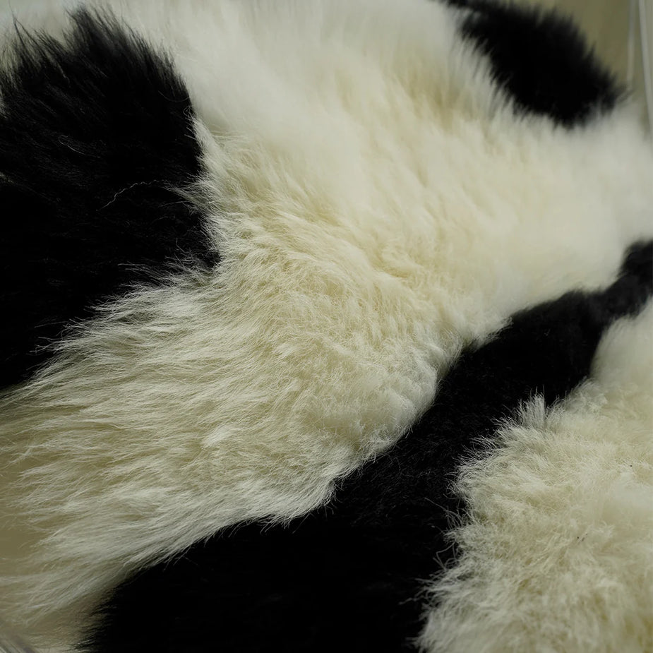 Close-up of a black and white fur rug