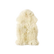 Beige faux fur rug on a white background