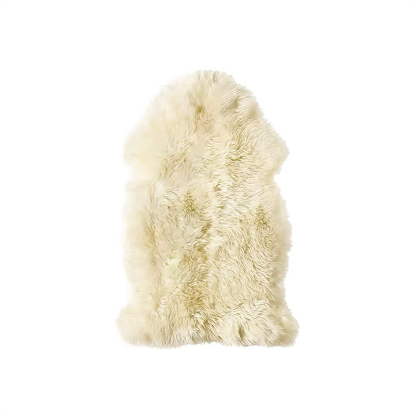 Beige faux fur rug on a white background