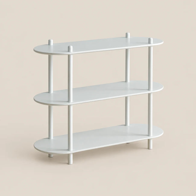 A three-tier white metal shelving unit with rounded rectangular shelves and slim vertical legs, shown on a solid light beige background.