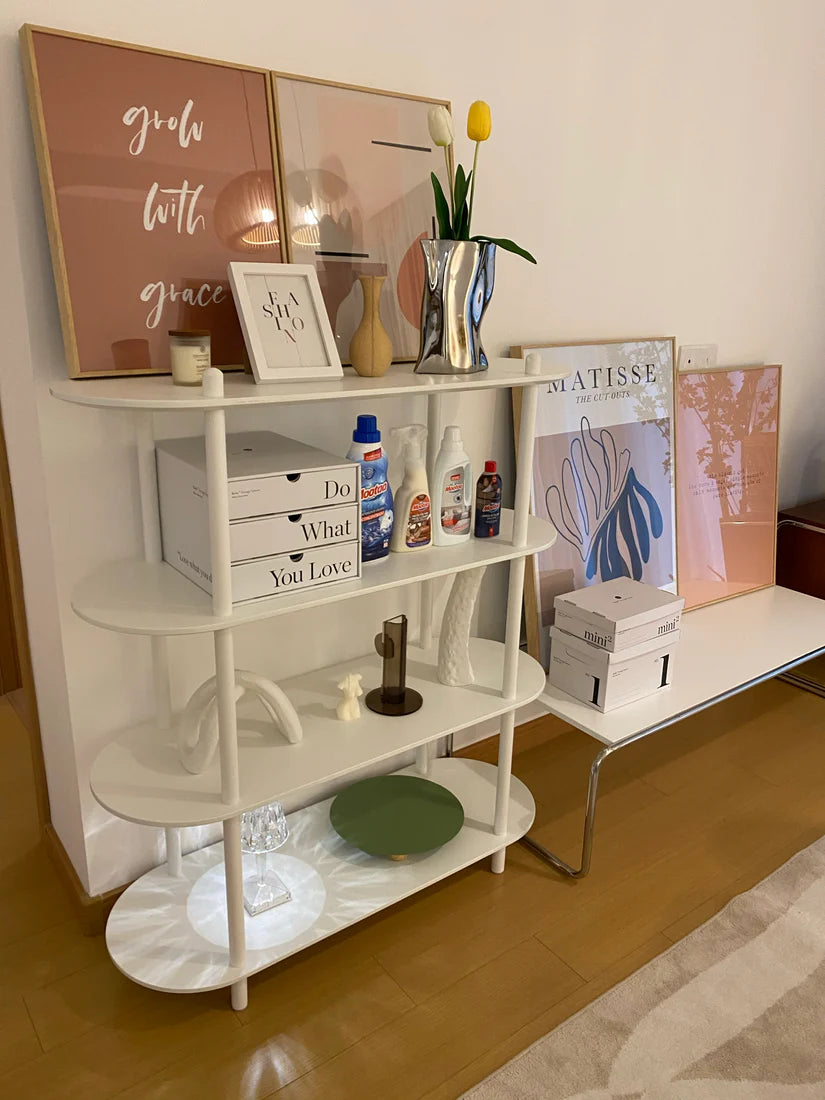 White shelving unit with decorative items in a room