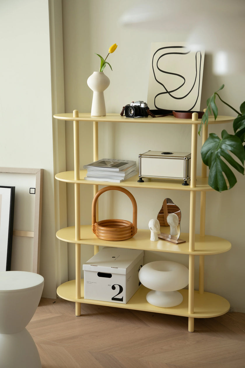 Yellow shelf with decorative items against a neutral wall