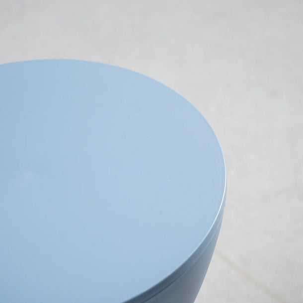 Stack of light blue paper on a light gray background