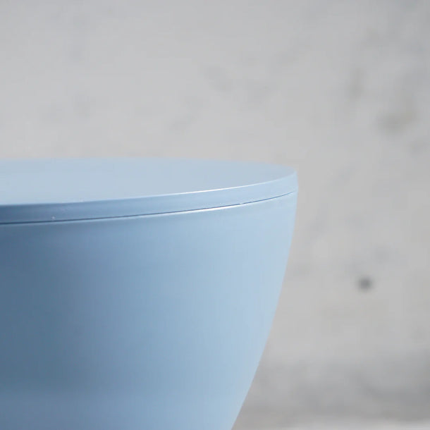 Light blue cylindrical object on a gray background