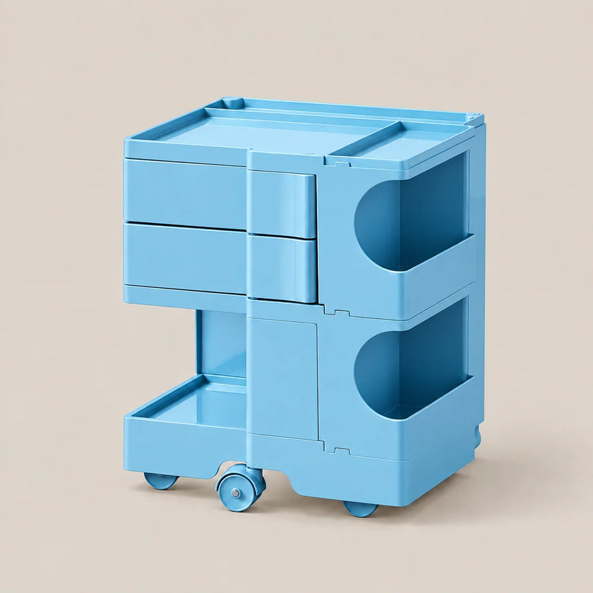 A light blue plastic rolling storage cart with three drawers, two open side shelves, and a top tray, shown on a plain beige background.