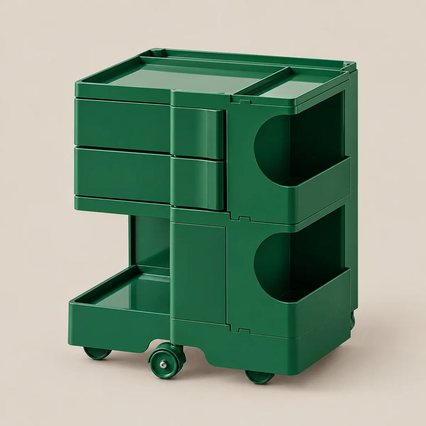 A dark green rolling storage cart with three drawers, open shelving compartments, and caster wheels, shown on a plain beige studio background.