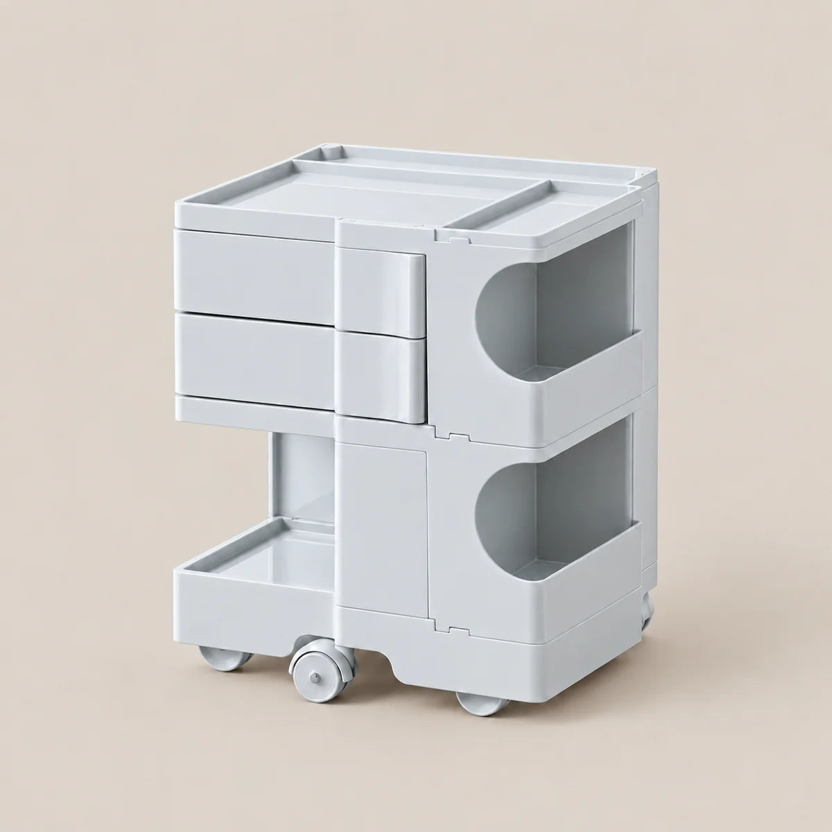 A light gray plastic rolling organizer cart with three drawers, two open side compartments, and a pull-out bottom tray, shown on a plain beige background.