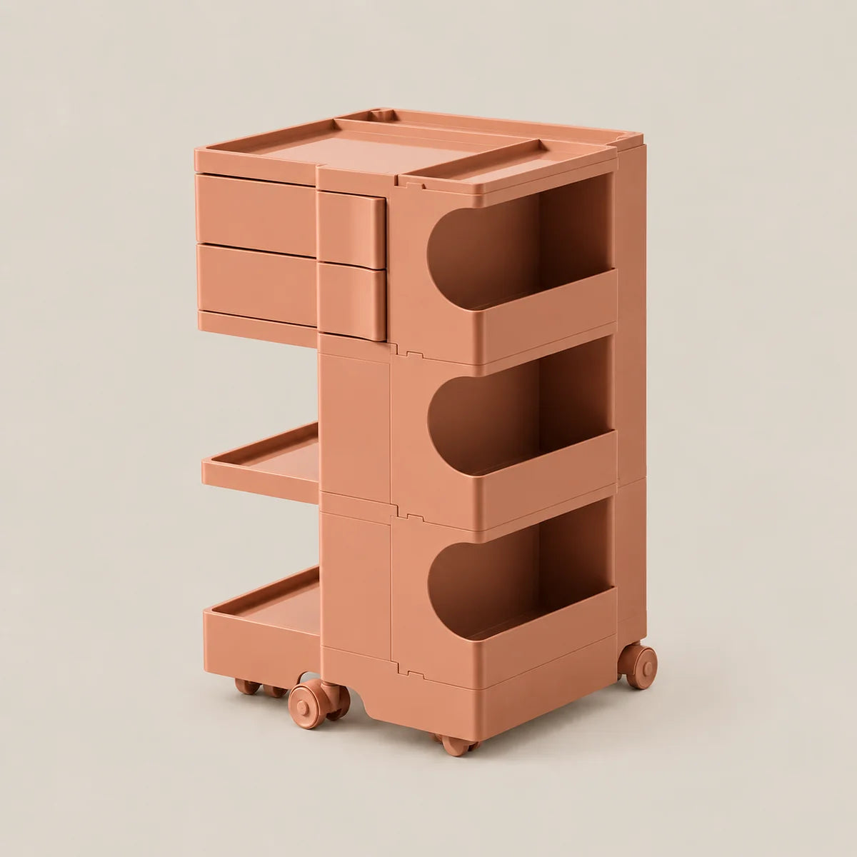 A terracotta-colored plastic rolling storage cart with three drawers, open shelves, and wheels, shown on a solid light beige background.