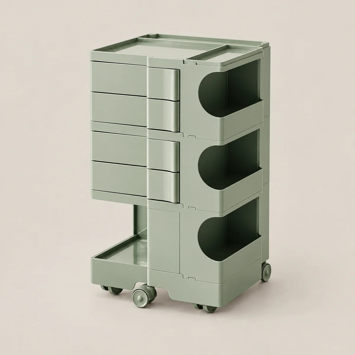 A modern three-tier rolling storage cart in a muted sage green color, featuring three drawers on the left and open storage compartments on the right, set against a solid light beige background.