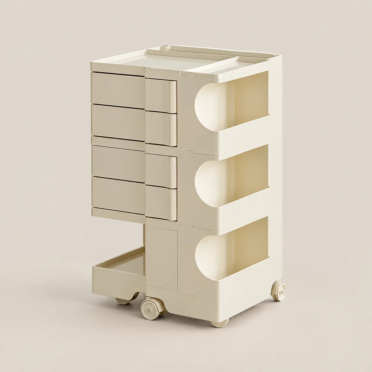 A cream-colored plastic rolling storage cart with five drawers on the left, three open storage compartments with curved cutouts on the right, and a pull-out tray at the bottom, shown on a solid light beige background.