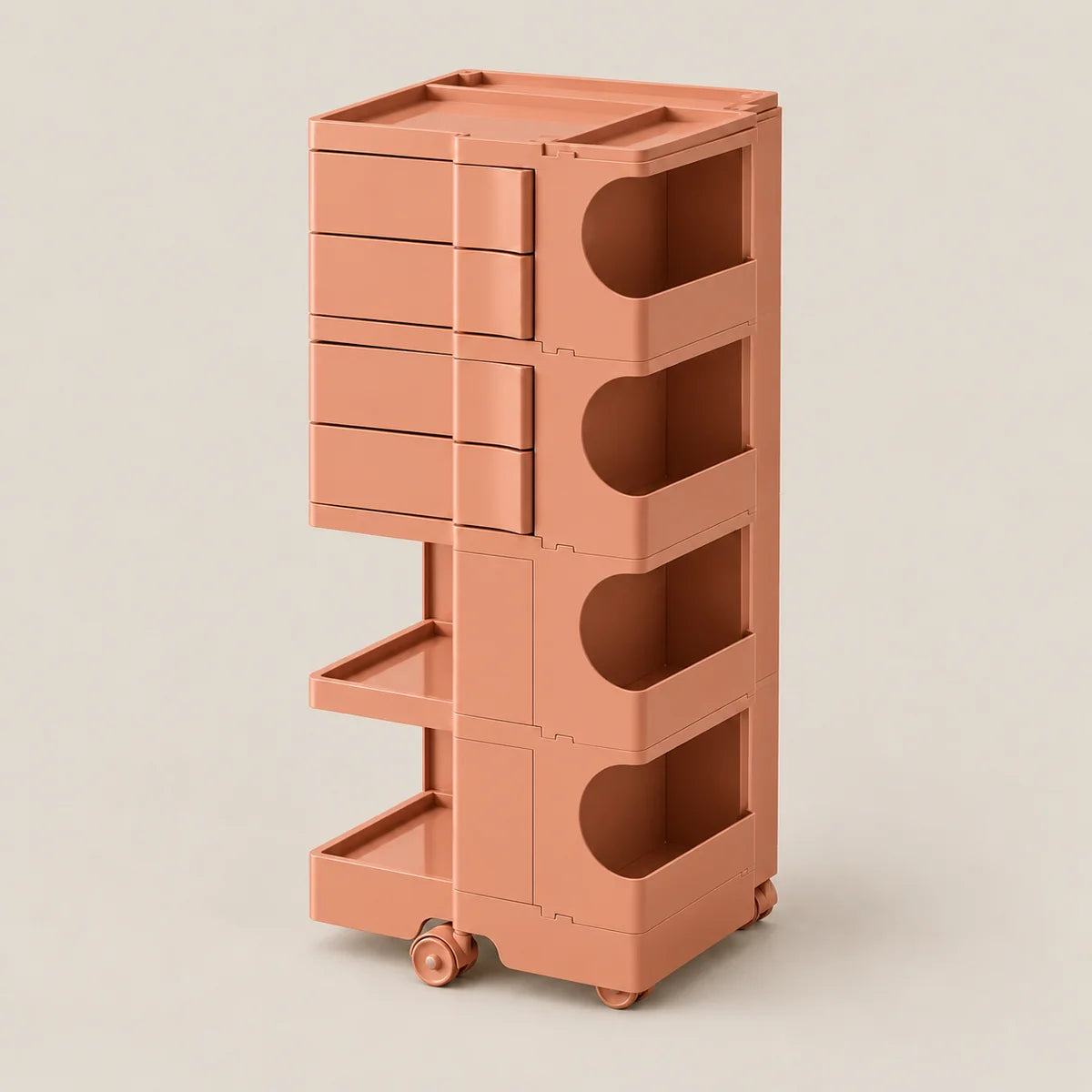 A tall, minimalist rolling storage cart in a warm terracotta or rose-brown color, featuring multiple drawers, open storage compartments, and lower pull-out trays on wheels, set against a solid light beige background.