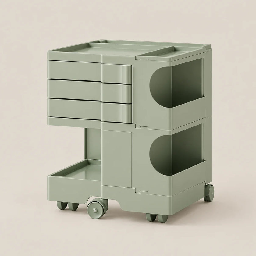 A sage green rolling storage cart with multiple drawers, open storage compartments, and caster wheels, shown on a plain beige background.