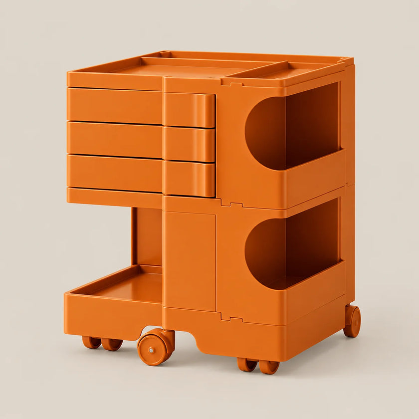An orange modular plastic storage cart with three drawers on the top left, two open storage compartments with semicircular cutouts on the right, a lower open shelf, and four caster wheels, shown on a light beige background.