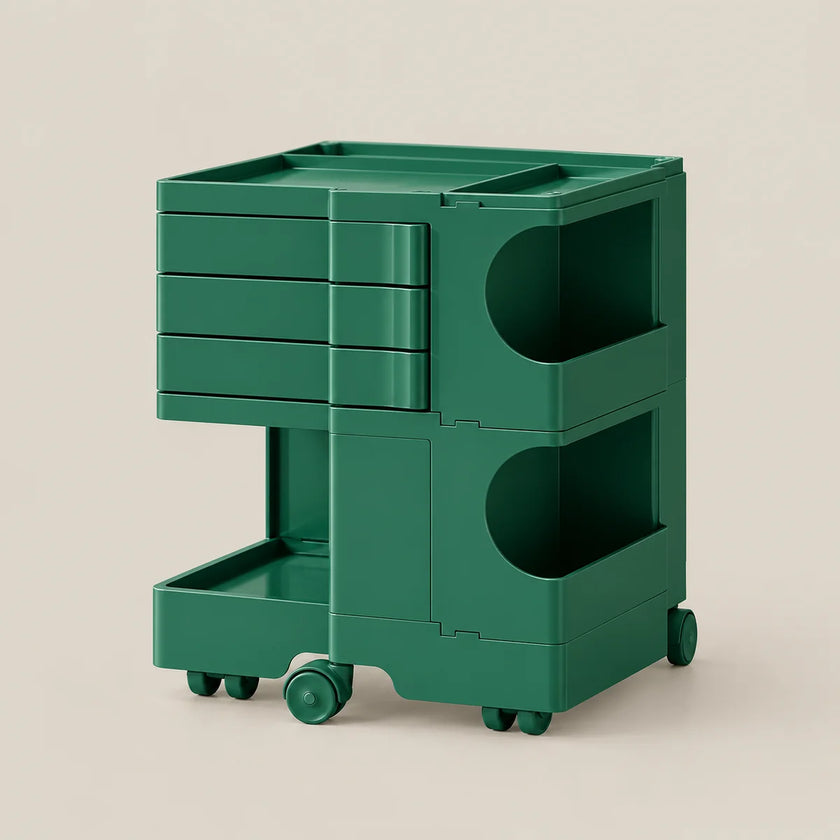 A dark green modular rolling storage cart with multiple drawers, open shelves, and caster wheels, shown on a plain beige studio background.