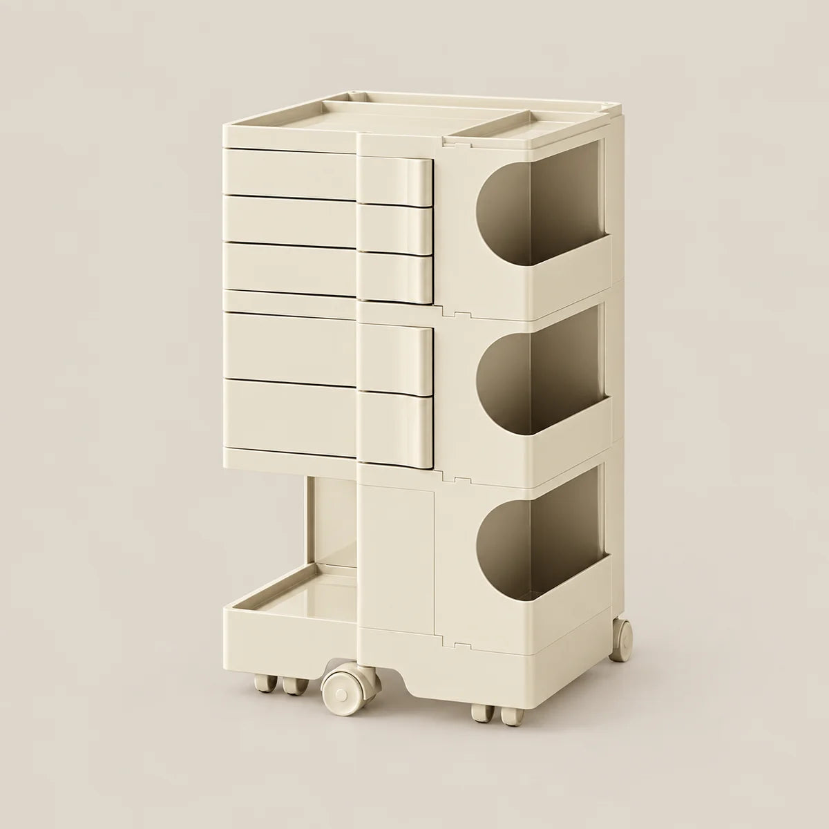 A cream-colored modular storage cart with multiple drawers and open cubbies, shown on a plain beige background.