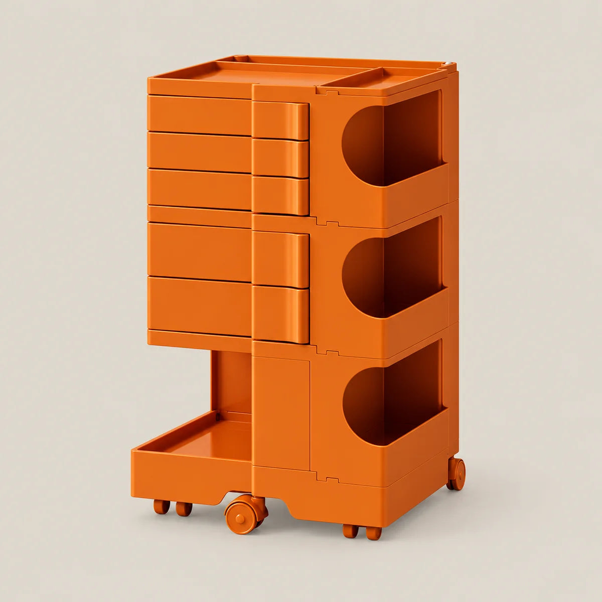 An orange rolling storage cart with multiple drawers, open cubbies, and a lower pull-out tray, shown on a plain light beige studio background.