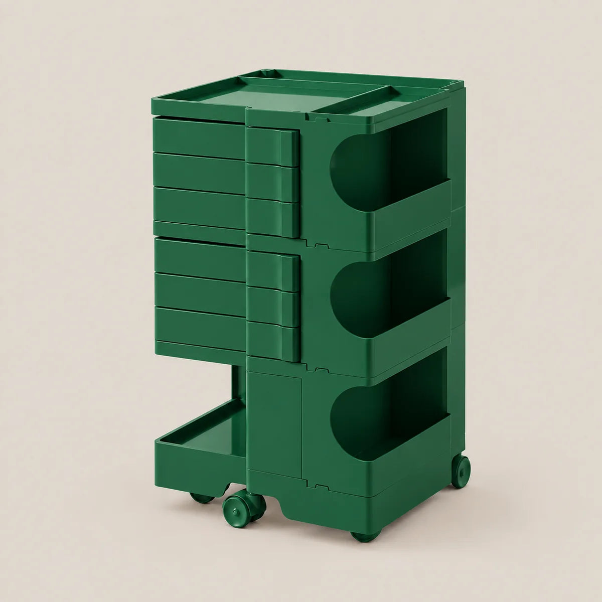 A dark green modular rolling storage cart with multiple drawers and open shelves, shown on a plain beige studio background.