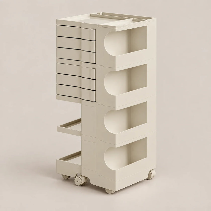 A tall, minimalist rolling storage cart in a warm off-white or cream color, featuring multiple drawers on the left and open shelving compartments on the right, set against a solid neutral background.
