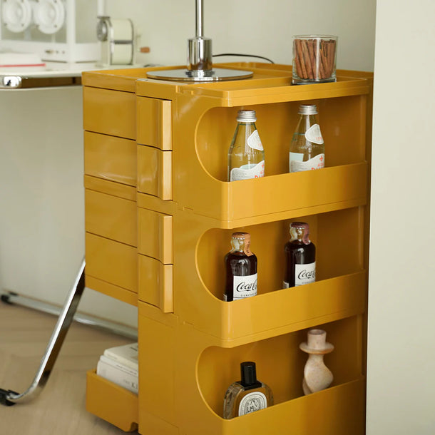 Yellow kitchen island with bottles on a neutral background