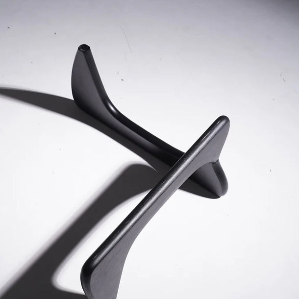 Black metal object on a white background