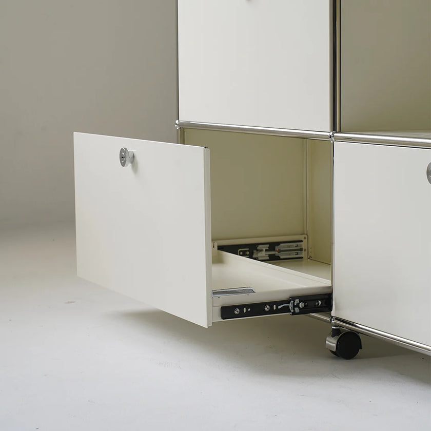 White cabinet with a drawer pulled out on a plain background