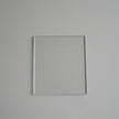 Square mirror on a plain gray background