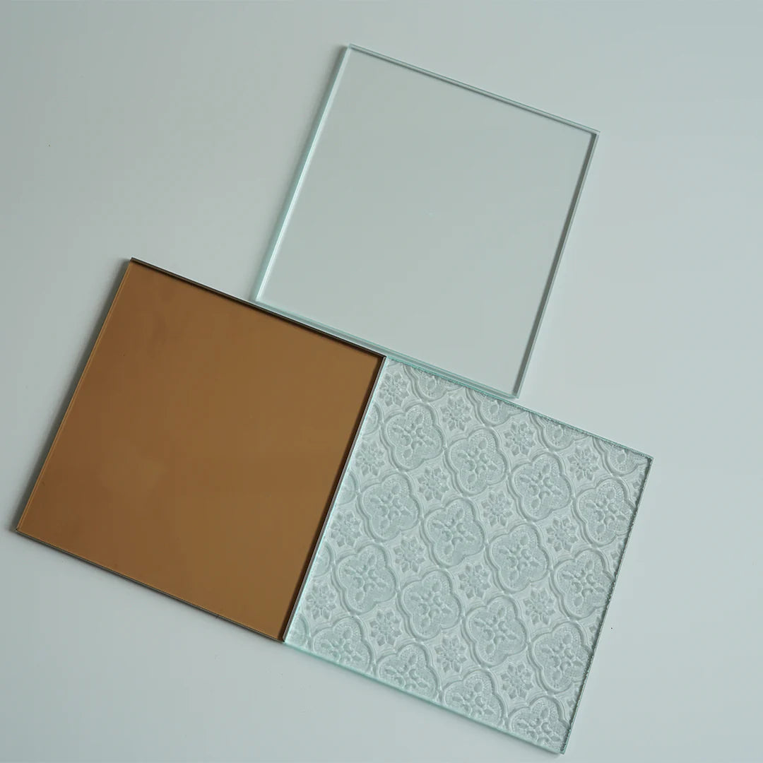 Three glass panels with different finishes on a light gray background