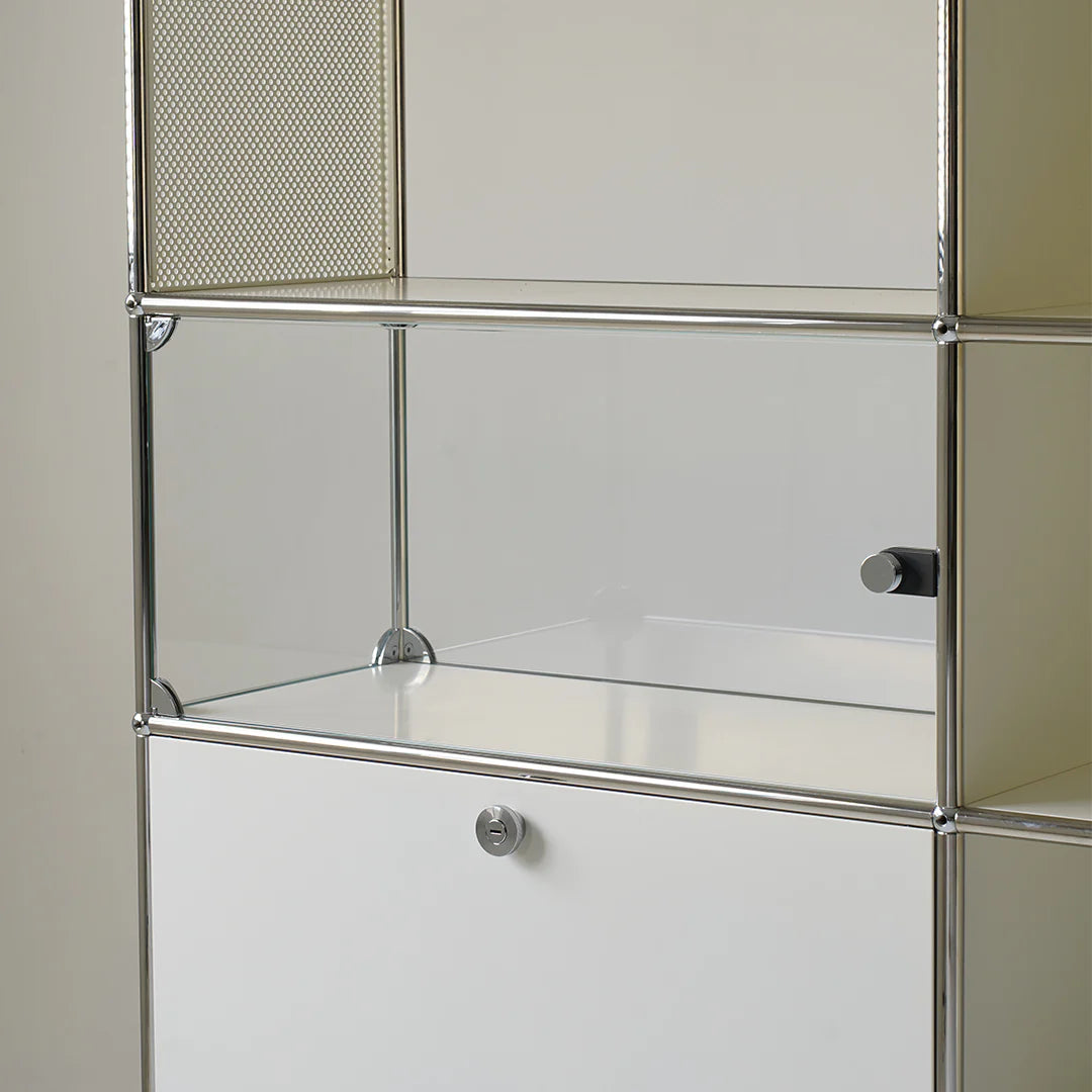 Metal shelving unit with glass shelves on a neutral background