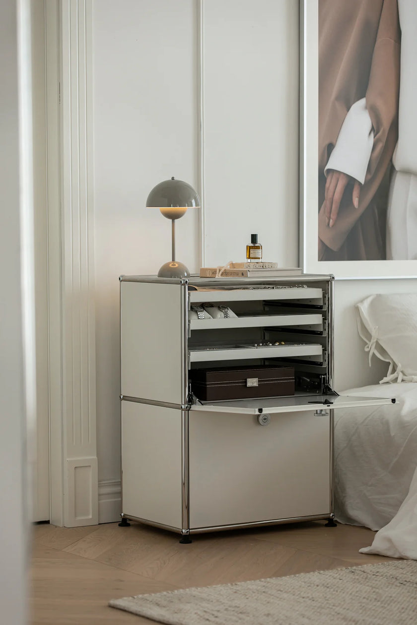 Modern nightstand with open drawer in a bedroom setting