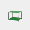 Green table with metal frame on a white background