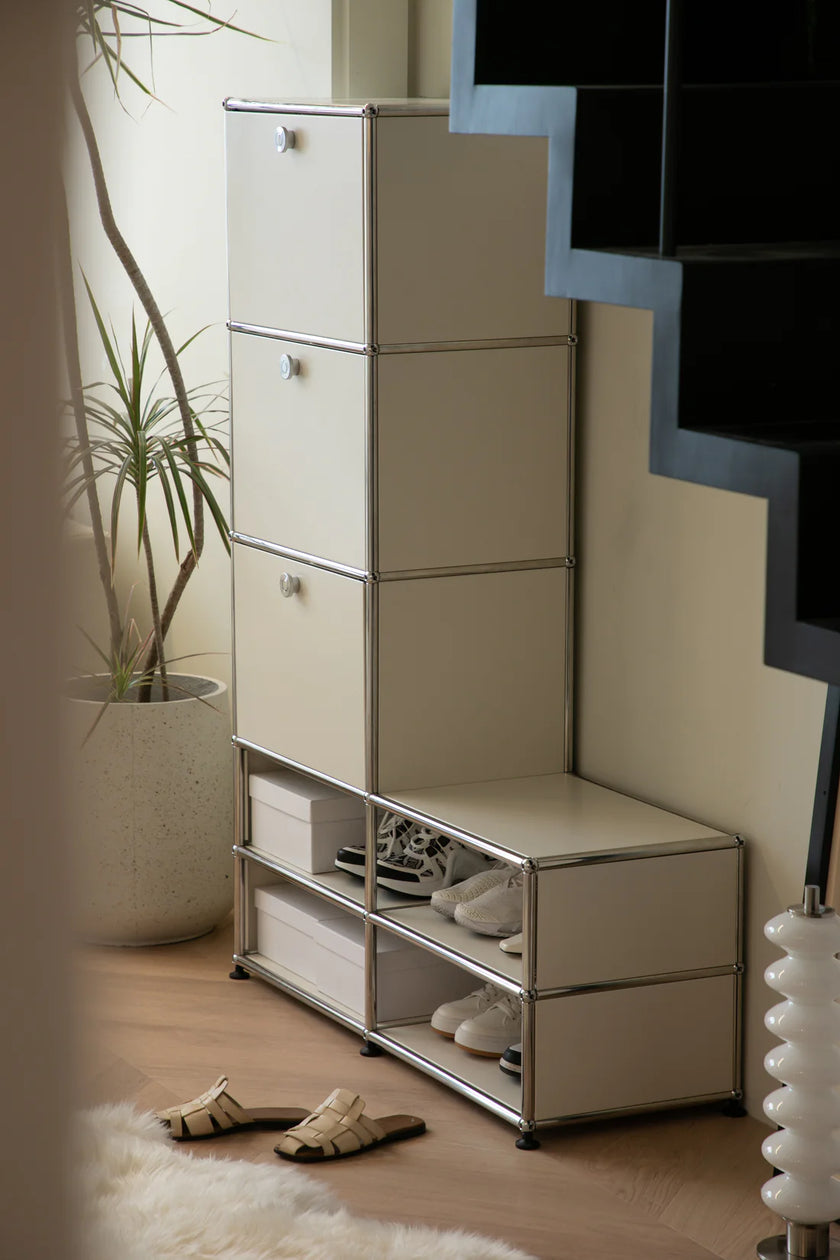 White storage unit with shelves and drawers in a room setting.
