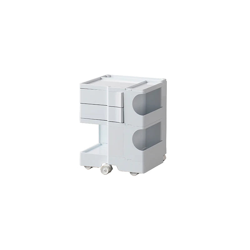 White rolling cart with drawers on a white background