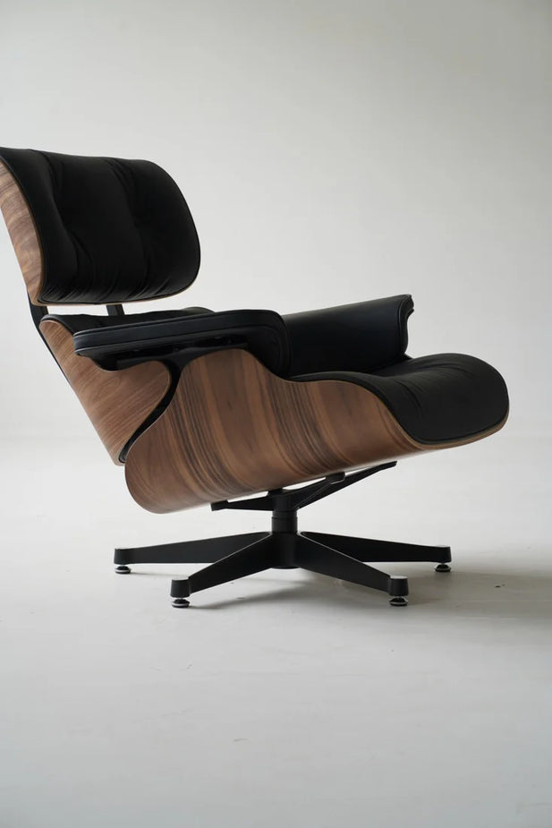 Modern lounge chair with ottoman on a white background