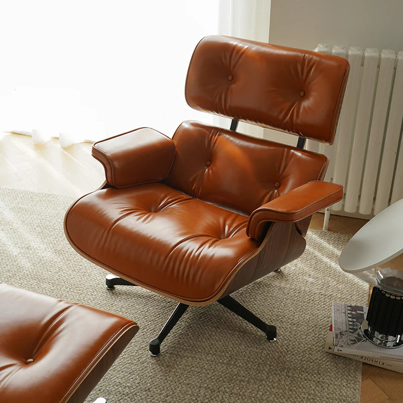 Brown leather armchair in a living room setting with a radiator in the background.